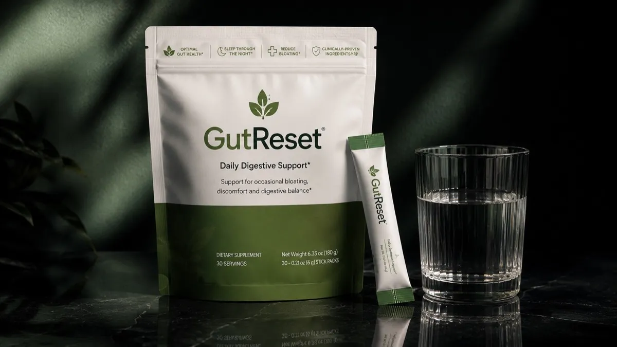 GutReset pouch and a stick pack next to a glass of water